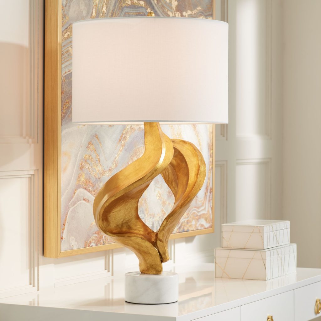 White and gold table lamp is a stylish and versatile accessory that can elevate the look and ambiance of any room. The combination
